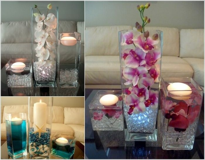 Dekoracija dnevne sobe z vodnimi svečami, okrasnimi kamni, školjkami in cvetjem