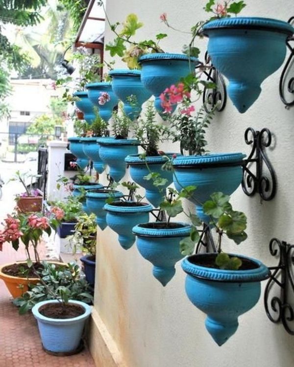 Hage dekorasjon ideer Blå blomster potter