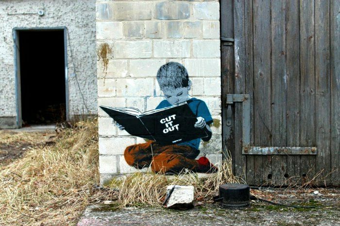 Barn tegelvägg graffiti Boy Book läsning