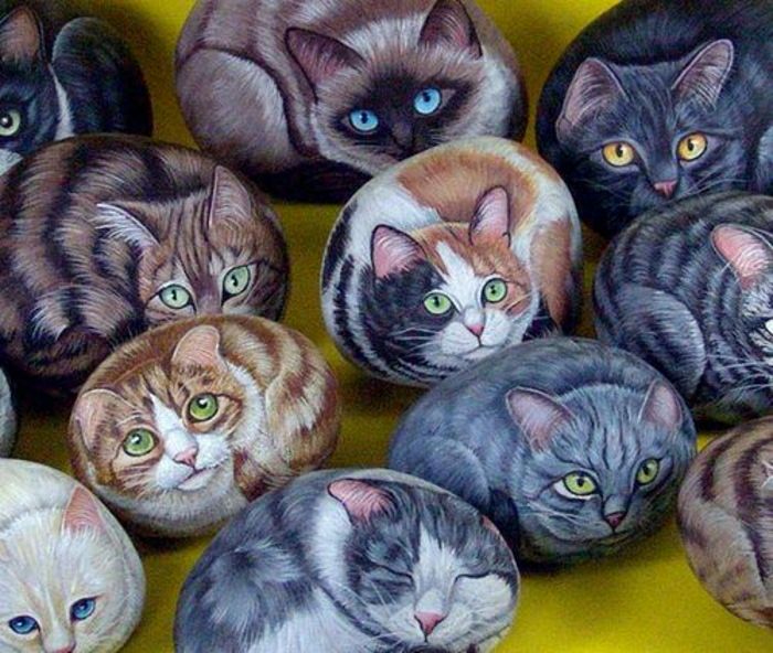Stenar målade kattpäls-eye olika färger