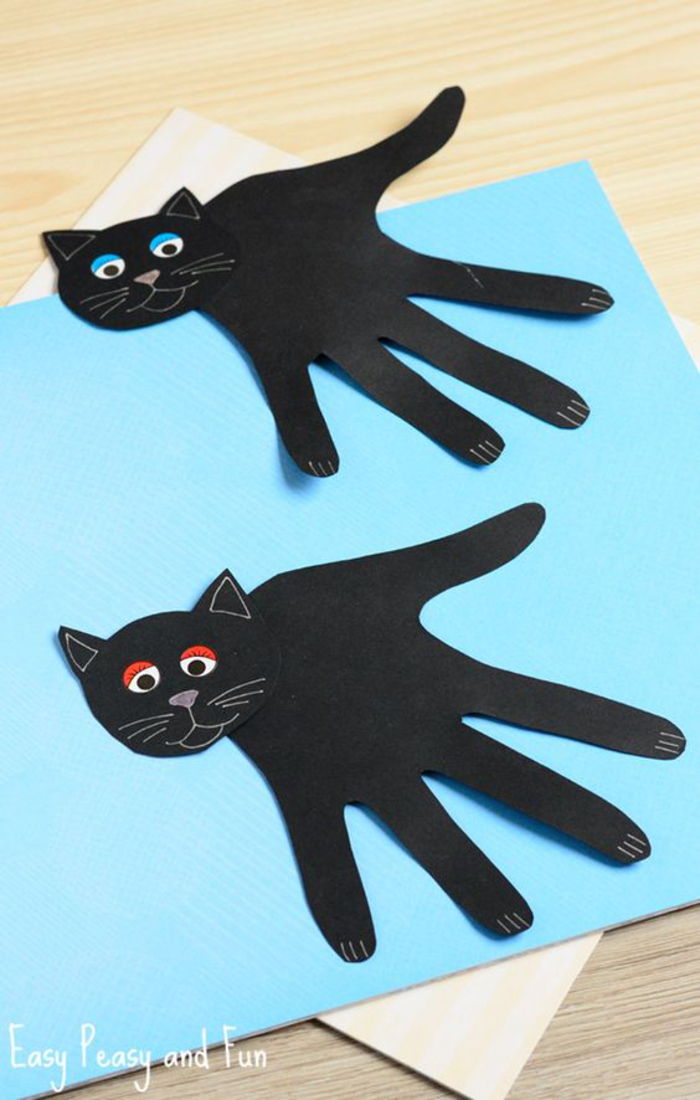 Idei DIY pentru copii, hârtie neagră de hârtie, handprint ca corpul pisicii