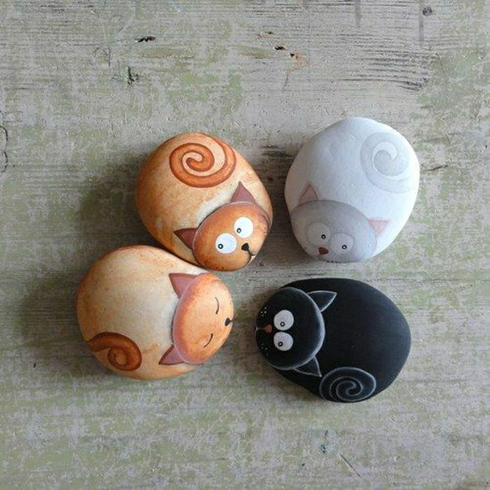 målade stenar Cat olika färgscheman