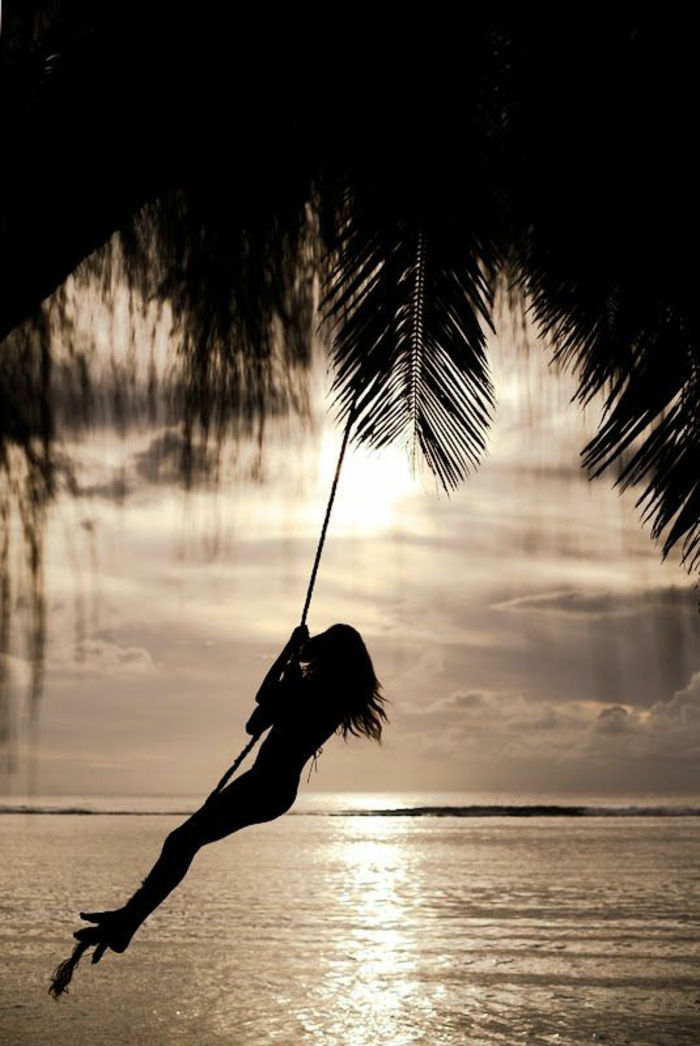 image-of-palmen-a-woman-on-a-swing