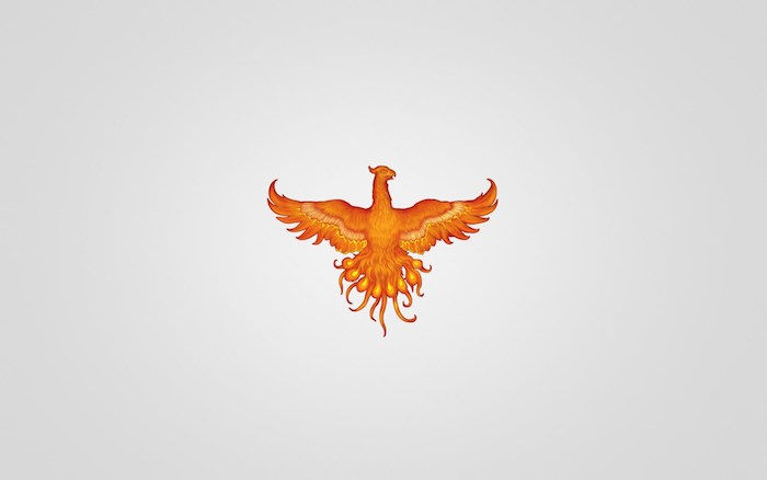 Pomysł na mały pomarańczowy tatuaż z latającym pomarańczowym płonącym feniksem z dwoma pomarańczowymi skrzydłami z czerwonymi i żółtymi piórami