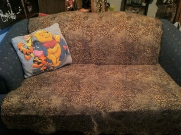 sofa-with-a-winnie-poh-pillow-cozy