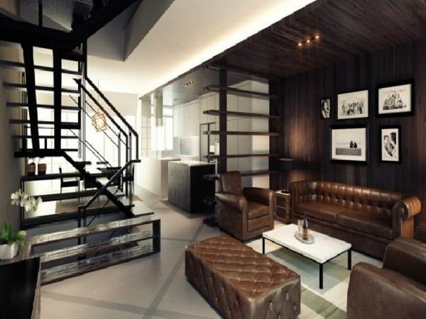 elegant vardagsrum-brun-toner-trappor och lädersoffa med två fåtöljer och en pall
