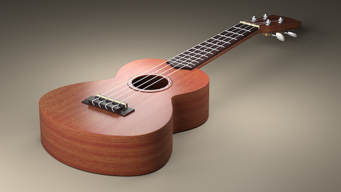 majhna dekorativna akustična kitara s štirimi najlonskimi vrvicami, ozadje v različnih sivih odtenkih