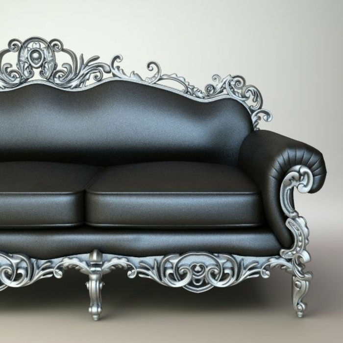 canapea din piele elegantă, în culoarea grafitului, cu două perne, picioare metalice în culoare gri, cu multe ornamente gotice