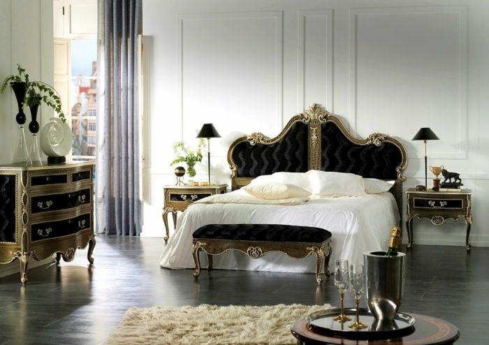 dormitor mare cu pat dublu în stil gotic, piept gotic în sertare negre și auriu, covor alb-murdar