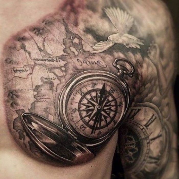 biała gołębica, duża mapa świata i duży czarny kompas - pomysł na tatuaż kompasowy dla człowieka
