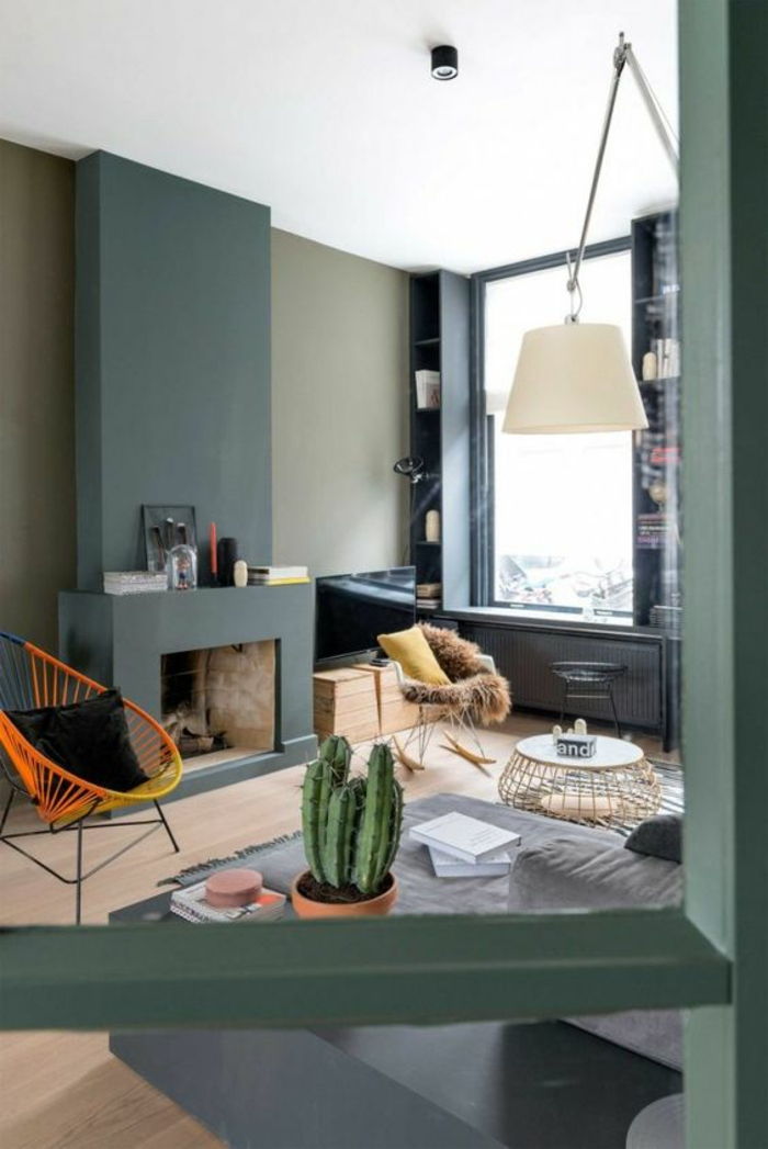 spis-murad-laminat färgad väggar-vide-gul-orange-svart-Kisse-gungstol-kaktus-round-soffbord