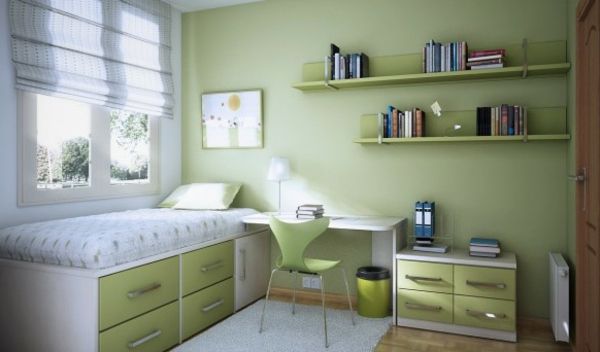 skrivbord vita sängkläder och grön väggfärg för barnrummet