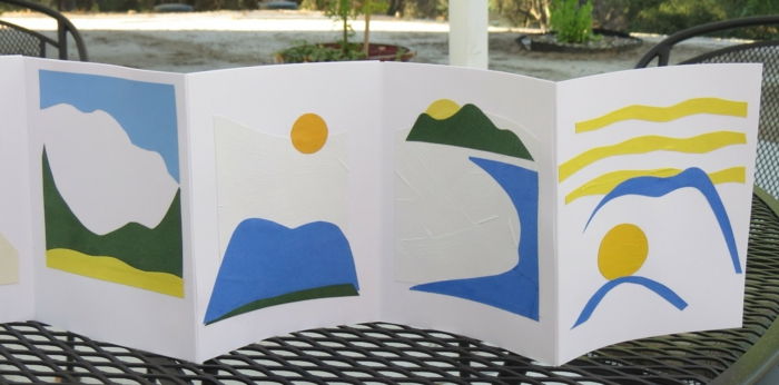 En sammenleggbar bok som barna har limt inn med en historie om sol