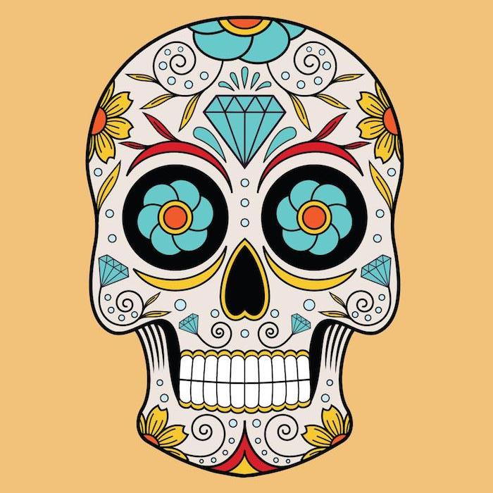 En meksikansk hodeskalle tatovering med store gule og blå blomster og diamanter