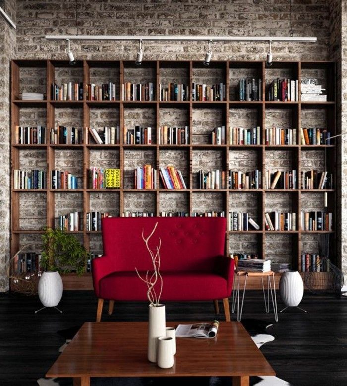 modern apartman tuğla duvarlar kitaplar duvar modern küçük kırmızı kanepe