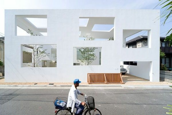 moderni idėja-už minimalistą-architektūra-vyras su dviračiu