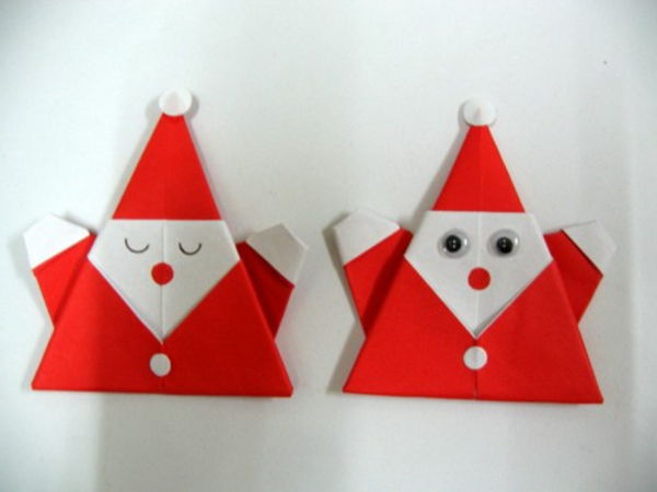 origami-till-jul-santa claus på den vita väggen
