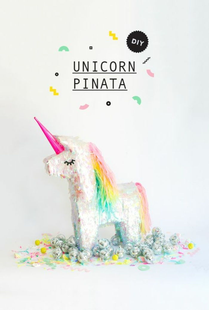 unicorn pinata selv-machining, rosa horn, hale og mane av farget papir