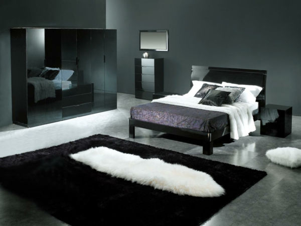 svarte møbler og veggdesign i det luksuriøse soverommet