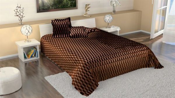 sängsäck-i-brun-super-säng-design - på en vit matta