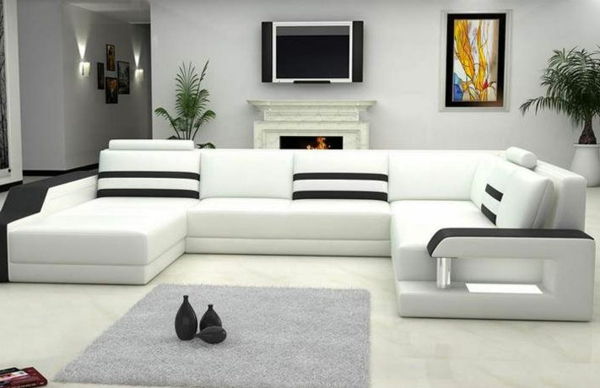 biało-kolorowy-narożnik-sofa-pokrycia-bardzo nowoczesny-z-telewizorem na ścianie